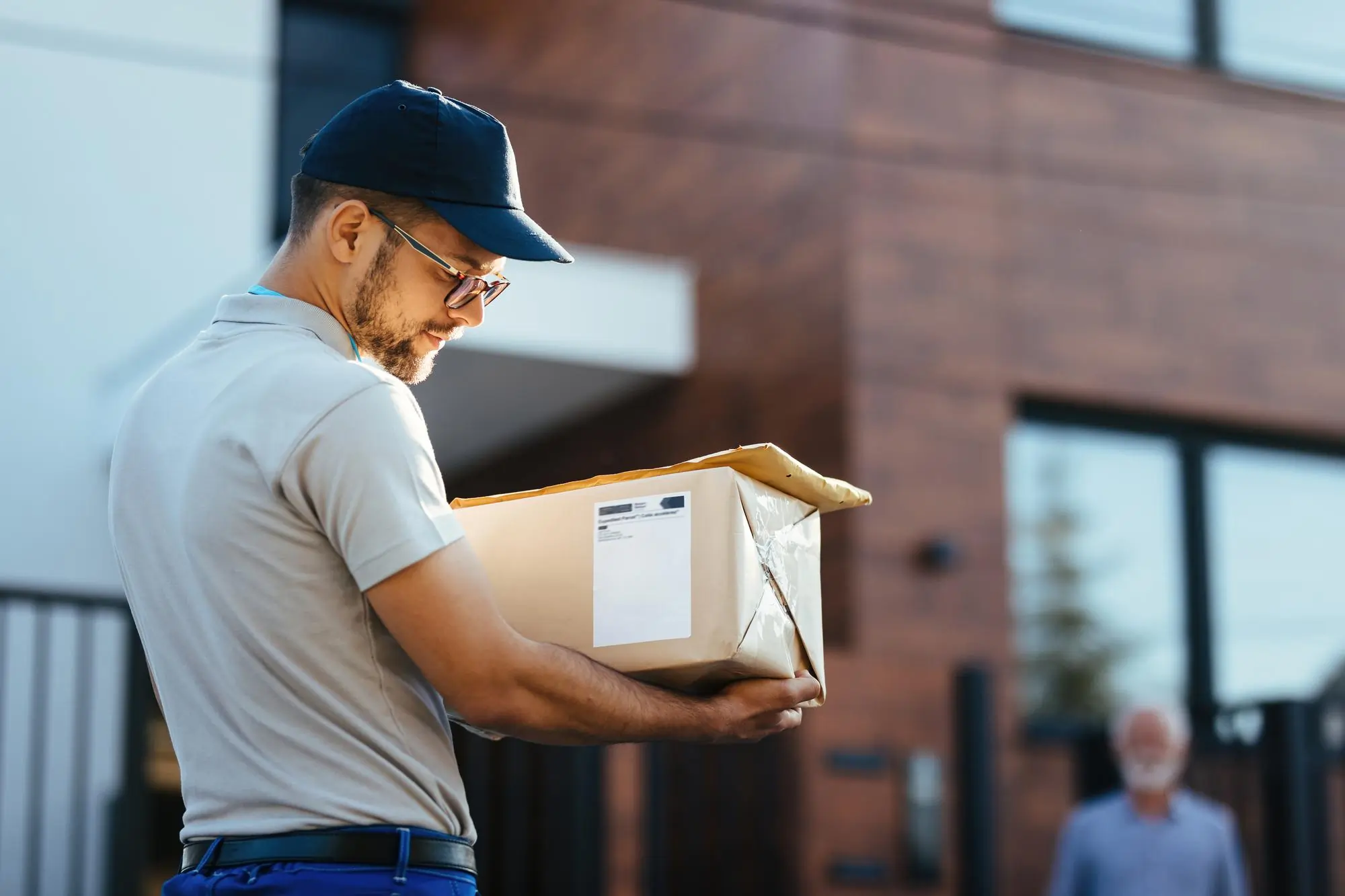 Private courier delivering a parcel for private courier services in Tirana and Durres